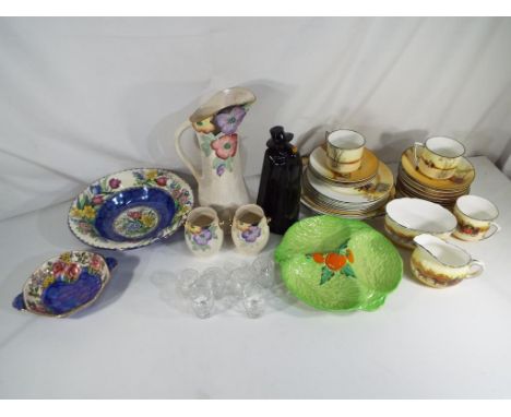 A Royal Doulton part tea service comprising cups, saucers, side plates, sugar bowl and creamer, twenty five pieces in total, 