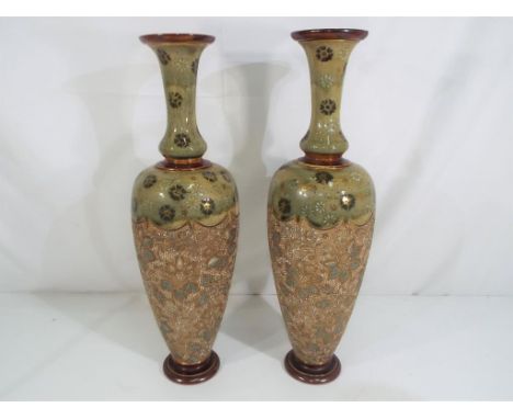 A pair of Royal Doulton Lambeth Ware ceramic vases with makers marks to the base, approximate height 41 cm (2)