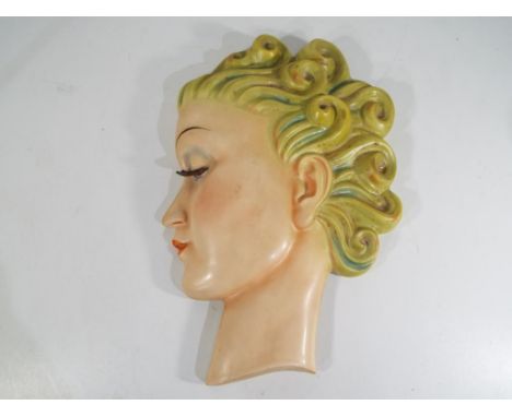 An art deco Goebel wall plaque depicting a lady's head designed by Agnes Richardson. Estimate £50 - £70