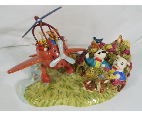 Royal Doulton - a limited edition Royal Doulton Rupert the Bear figural group entitled Rupert Takes a Flying Lesson #333 of 2