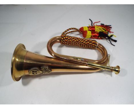A brass bugle Est £30 - £40