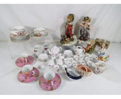 A collection of late 19th and early 20th century ceramic table ware and ornamental ware to include Dresden, Capodimonte, a tr