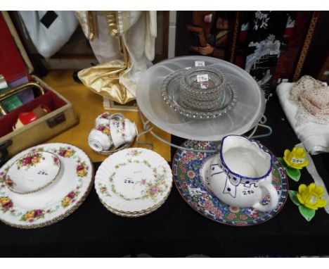 A good mixed lot of glassware and ceramics to include a large smoked glass centrepiece, a retro trifle bowl set with beaded e