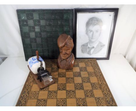 Two chess boards, a wooden carved sculpture, a pencil drawing depicting Jonathan Wood signed by the artist lower right mounte
