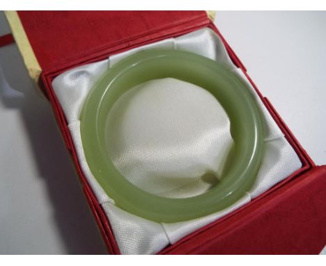A jade bangle in presentation box