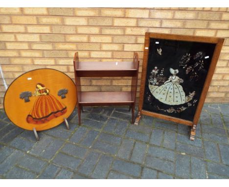 A c. 1920's crinoline lady oak and glass firescreen, an Art Deco style crinoline lady circular wooden fire screen and two fre