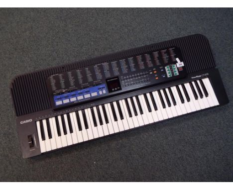 A Casio ToneBank CT-670 electronic keyboard with stand and mains lead (the stand not shown in the illustration) - Est £15 - £