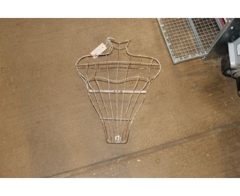 A vintage wirework mannequin torso