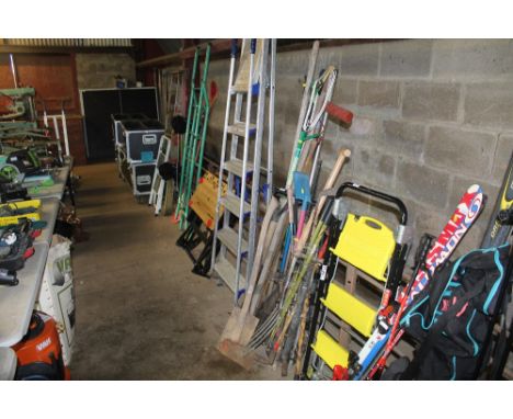 Three bundles of various garden tools including rakes, fork, spade, axe, pick axe, long handled pruner etc.