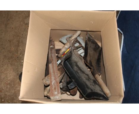 A box of assorted hand tools and shoe last