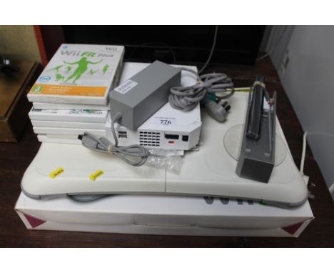 A Nintendo Wii games console with Wii fit board and games