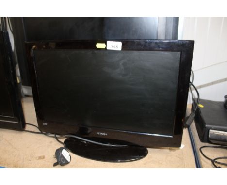 A Hitachi flat screen television lacking remote control