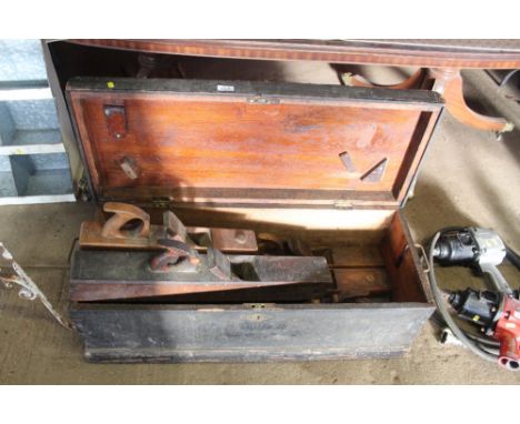 A carpenters tool box and contents including large jack planes etc.