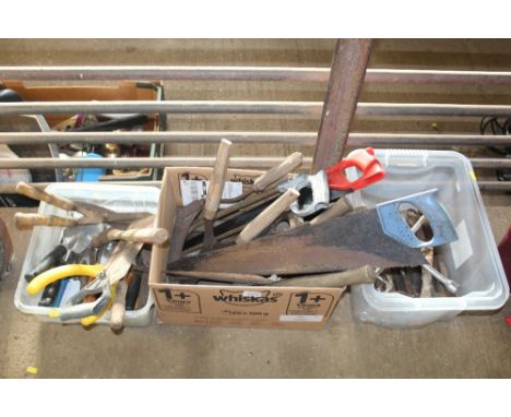 Three boxes containing various hand tools including hand saws