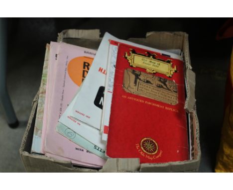 A box containing an eight track cassette; various games and Ordnance Survey maps