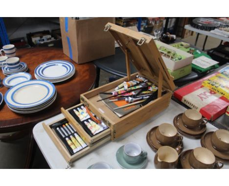 An artists easel box and contents of materials