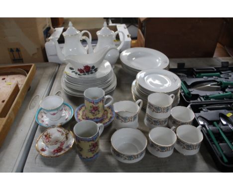 A quantity of Staffordshire "Mid Winter" dinner plates; Royal Grafton tea pots; Royal Standard bone china mugs; Copeland Spod
