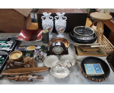 A quantity of advertising tins; cased mantel clock; a pair of vases; wooden ornaments etc