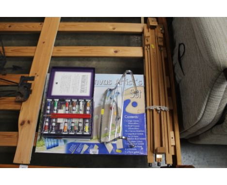 An artist easel and various other artists materials