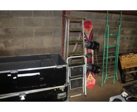 A folding metal step ladder and vintage wooden step ladder