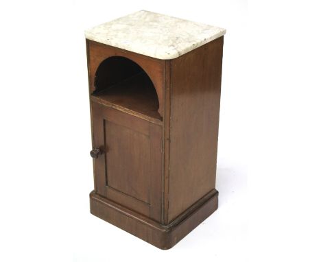 A 20th century marble topped mahogany cupboard. With a single shelf over a panelled door with turned handle, raised on a plin