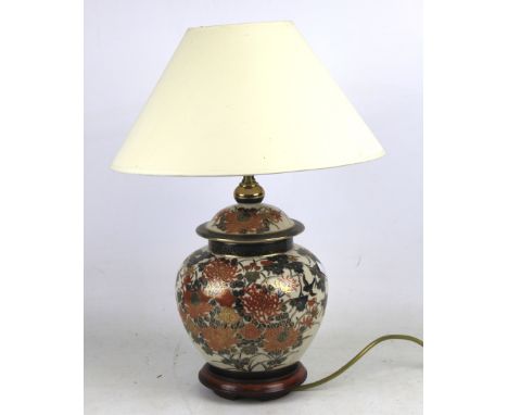 A ceramic Oriental bulbous shaped table lamp with shade H47cm.