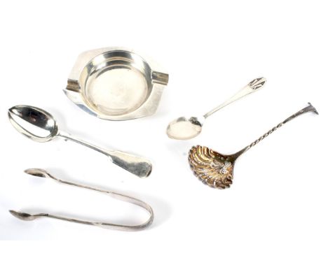 An assortment of silver items including an ashtray, sugar ladle, sugar snips, teaspoons etc 97 grams.