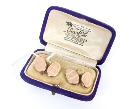 A pair of 9ct gold oval shaped cufflinks with engine turned decoration, hallmarked Birmingham 4.0grams.