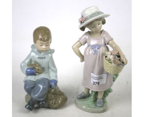 A Lladro figure and a Nao figure. The Lladro figure modelled as a girl holding a basket H20cm, the Nao figure of a seated boy