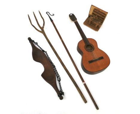 An assortment of collectables. Comprising a shepherd's crook, hay fork, yok, guitar and a scratch built wooden sculpture of a