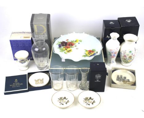 An assortment of ceramics and glassware. Including a Royal Worcester bowl, Aynsley vase, Stewart and Dartington vases etc, so