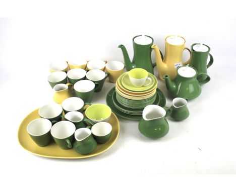 A selection of Poole Pottery tea and coffee services. Including cups and saucers, plates, platter and teapots and coffee pots
