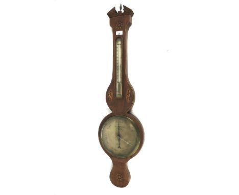 A Georgian mahogany wheel barometer. With gilt dial and a thermometer positioned above, the case with a broken arch pediment 