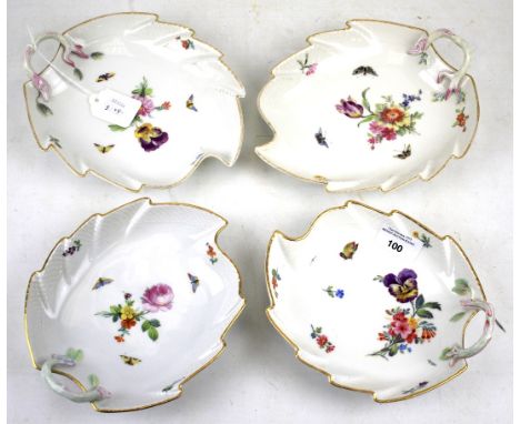 Four KPM porcelain leaf shape dishes. All with gilt rims and floral details on a white ground, L19.5cm Condition Report: Colo