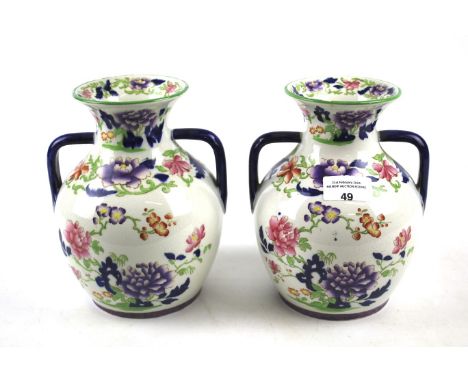 A pair of 19th Century Copeland late Spode twin handle vases. Decorated with floral details on a cream ground, H19cm