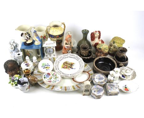 An assortment of ceramics. Including two Staffordshire spaniels, Wade tortoise, Poole dish, Gibson floral jugs etc