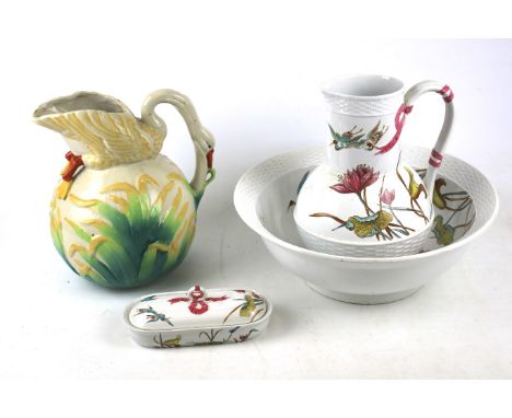 A Victorian Brownfield Audley wash set and one other jug modelled as a swan. The pitcher, bowl and soap dish with pink ribbon