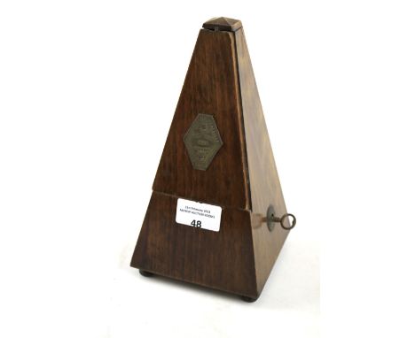 A mahogany cased French metronome. With metal plaque to the front, H22cm