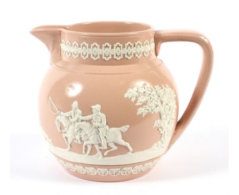 A mid-19th century Copeland pink stoneware jug. Impressed marks, moulded in white high relief with a hunting scene (cracked),