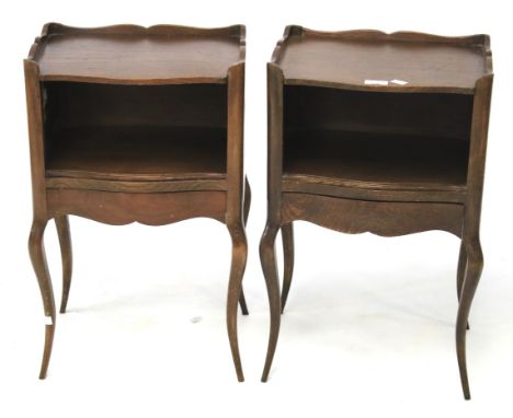 A pair of oak Queen Anne style bedside cabinets. Possibly French, the open upper shelf over a single concealed drawer, raised