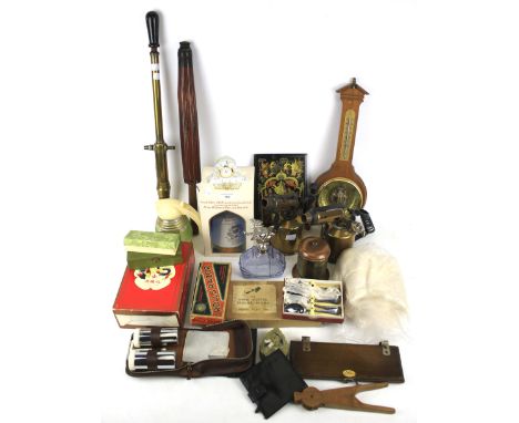 An assortment of collectables. Including a banjo barometer, leather wallets, a copper and brass tea caddy, flatware and Sieve