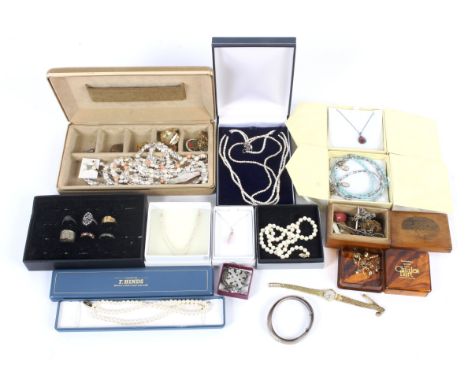 An assortment of costume jewellery. Including imitation and saltwater pearl necklaces, some with 9ct gold clasps, a cameo hai