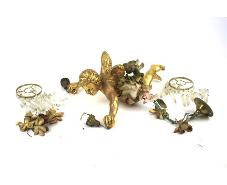 A vintage gilt flying cherub ceiling light. Modelled holding two glass drop chandeliers, L33cm Condition Report: Cherub is ov