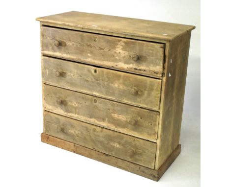 A vintage pine chest of drawers. Four long drawers with turned handles, raised on a plinth base, L109cm x D44.5cm x H105cm