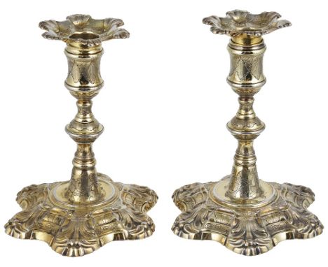 A PAIR OF GEORGE II SILVER-GILT DWARF CANDLESTICKS, JOHN CAFE, LONDON, 1754cast shell sexafoil pattern, conforming nozzles, l