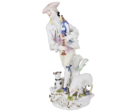 A MEISSEN LARGE FIGURE OF A SHEPHERD, CIRCA 1755standing playing bagpipes, a grazing sheep and a recumbent dog at his feet, h