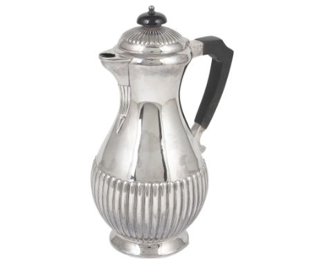 A VICTORIAN SILVER HOT WATER JUG, FENTON BROTHERS, SHEFFIELD, 1884part lobed baluster, engraved with the monogram SMW23.5cm h