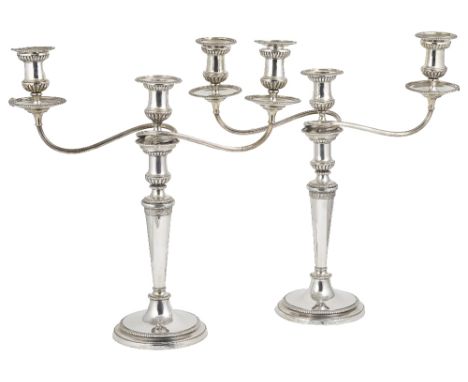 A PAIR OF GEORGE III SILVER CANDLESTICKS, JOHN SCOFIELD, LONDON, 1798, WITH THEIR CONTEMPORARY SHEFFIELD PLATE CANDELABRA BRA