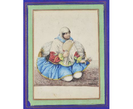 ‡ PORTRAIT OF A GIRL, QAJAR PERSIA, 19TH CENTURYwatercolour on paper, laid on an album page, the subject depicted seated agai