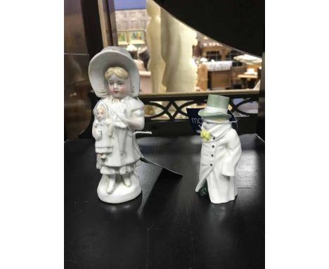 ROYAL WORCESTER CANDLE SNUFFER 'BUDGE'along with a ceramic figure of a girl with a doll